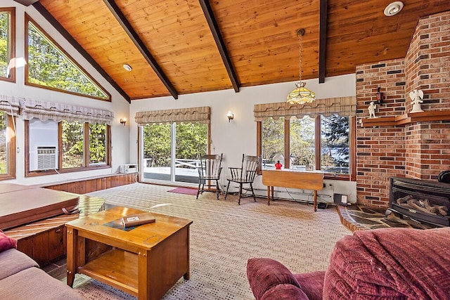 66 Brickett Point Ests, Oakland, ME 04963 - carpeted living room with high vaulted ceiling, a wood stove, wooden ceiling, and beamed ceiling