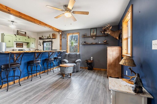 194 Birch Ln, Unity, ME 04988 - sitting room with light wood-type flooring, a ceiling fan, beamed ceiling, and baseboards