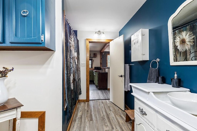 194 Birch Ln, Unity, ME 04988 - full bathroom featuring wood finished floors and vanity