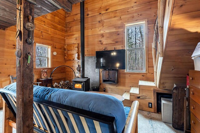 194 Birch Ln, Unity, ME 04988 - living area with a wood stove and wood walls