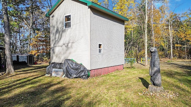 194 Birch Ln, Unity, ME 04988 - view of home's exterior with a storage unit and an outdoor structure