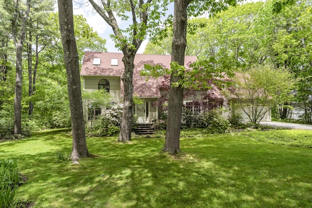 298 Ocean Ave, Kennebunkport, ME 04046 - view of front of house featuring a front yard, driveway, and an attached garage