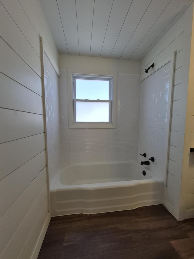 bathroom with wood finished floors and bathtub / shower combination