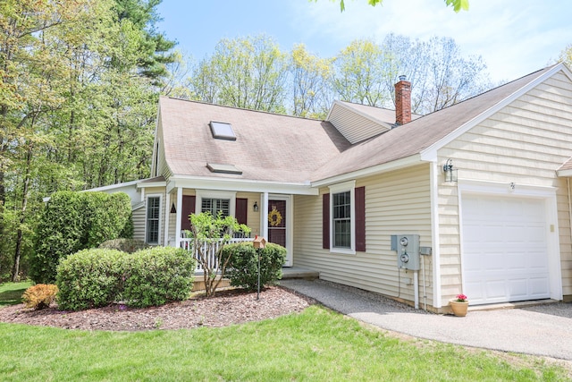 28 Winchester Ct Unit 36, Kennebunk, ME 04043 - cape cod house with a garage, covered porch, a chimney, and roof with shingles