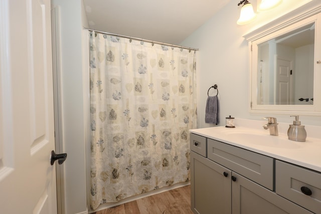 28 Winchester Ct Unit 36, Kennebunk, ME 04043 - bathroom featuring wood finished floors, vanity, and a shower with curtain