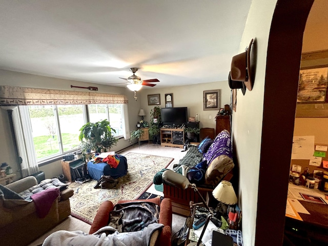 3 Rush Blvd, Millinocket, ME 04462 - carpeted living room featuring ceiling fan and arched walkways