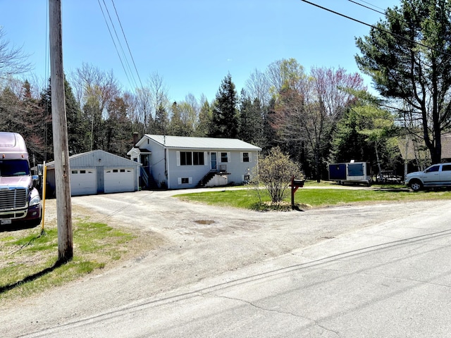 3 Rush Blvd, Millinocket, ME 04462 - ranch-style house featuring an outdoor structure, a garage, driveway, and a front yard