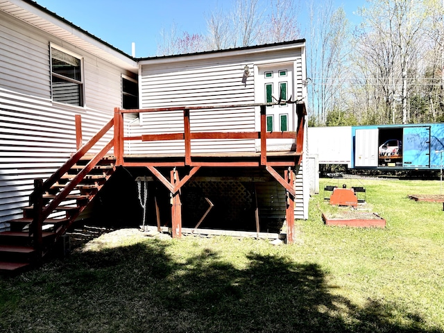 3 Rush Blvd, Millinocket, ME 04462 - back of house featuring stairs, a deck, and a lawn
