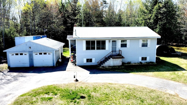3 Rush Blvd, Millinocket, ME 04462 - ranch-style house featuring an outdoor structure, a detached garage, and a front yard