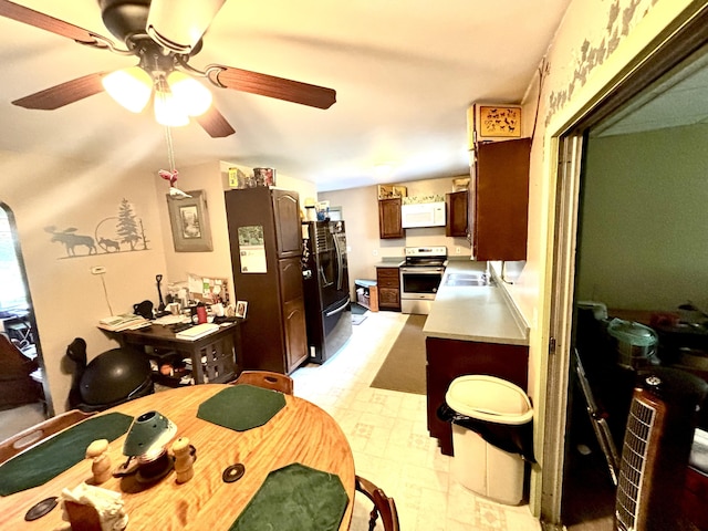 3 Rush Blvd, Millinocket, ME 04462 - kitchen featuring white microwave, stainless steel range with electric cooktop, black fridge, light countertops, and a ceiling fan