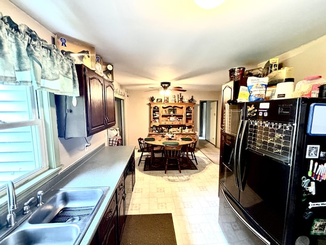 3 Rush Blvd, Millinocket, ME 04462 - kitchen featuring freestanding refrigerator, light flooring, dark brown cabinets, and ceiling fan