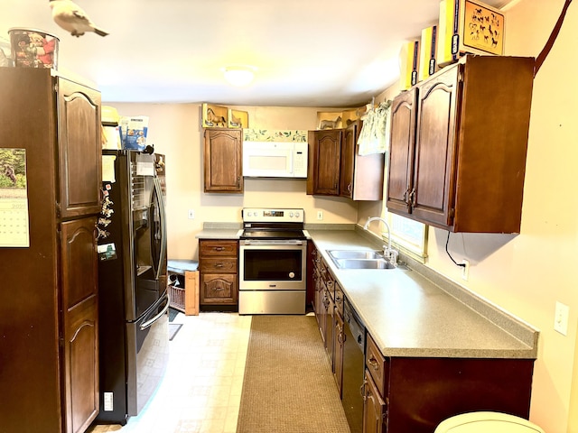 3 Rush Blvd, Millinocket, ME 04462 - kitchen featuring stainless steel electric stove, black fridge, white microwave, dishwasher, and light countertops