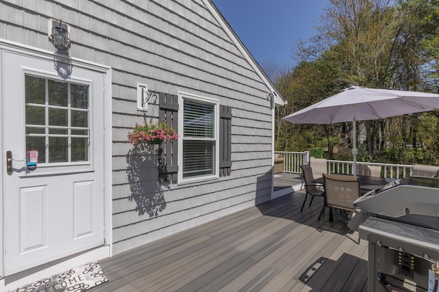 deck with outdoor dining area