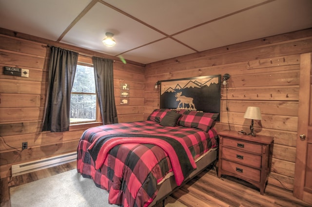 285 Quimby Pond Rd, Rangeley, ME 04970 - bedroom featuring baseboard heating, wooden walls, and wood finished floors