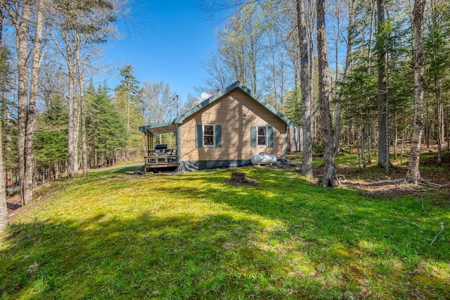285 Quimby Pond Rd, Rangeley, ME 04970 - view of property exterior featuring a deck and a lawn