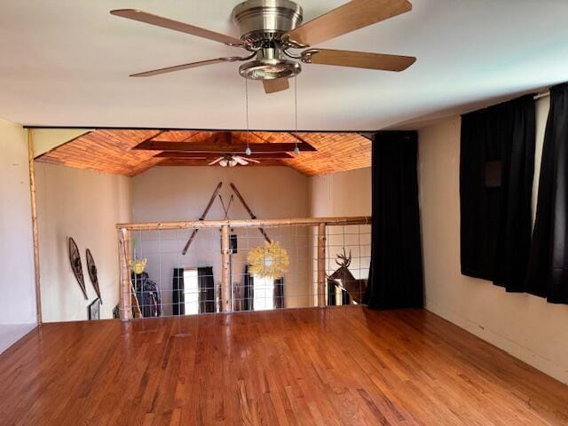 empty room featuring ceiling fan and wood finished floors