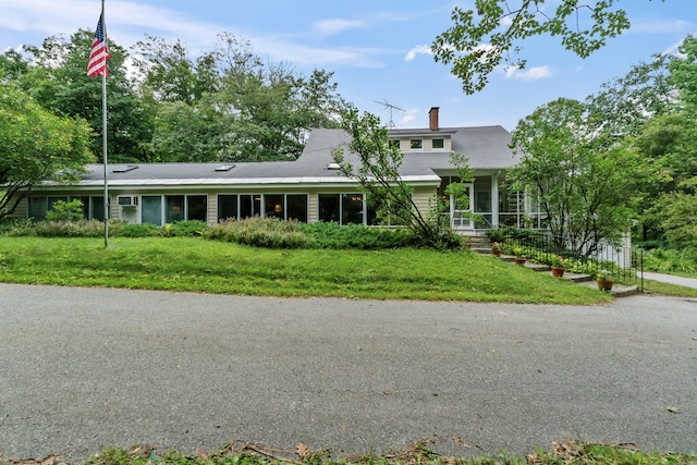 491 Lake Shore Dr, Auburn, ME 04210 - view of front of house featuring a chimney and a front yard