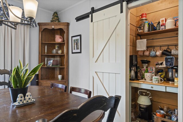 70 Lions Ridge Dr, Alna, ME 04535 - dining area featuring a barn door and ornamental molding