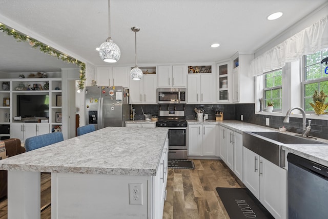 70 Lions Ridge Dr, Alna, ME 04535 - kitchen with appliances with stainless steel finishes, a sink, light countertops, white cabinets, and glass insert cabinets