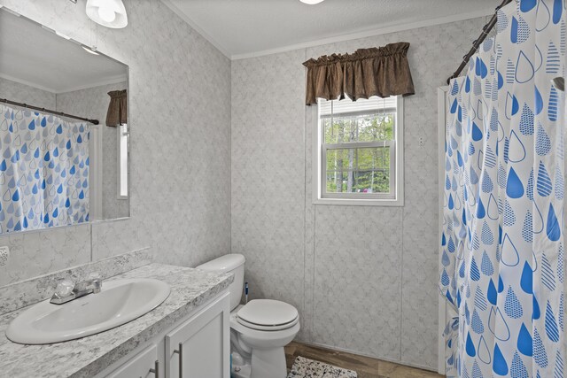 70 Lions Ridge Dr, Alna, ME 04535 - full bath with ornamental molding, vanity, toilet, a shower with shower curtain, and wood finished floors