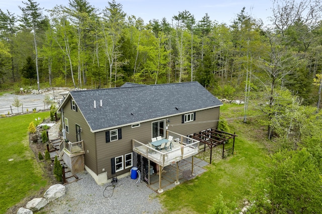 70 Lions Ridge Dr, Alna, ME 04535 - back of house with a deck, a shingled roof, stairs, and a forest view
