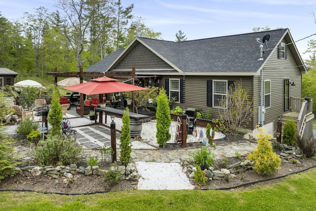 70 Lions Ridge Dr, Alna, ME 04535 - rear view of house featuring a patio and a shingled roof
