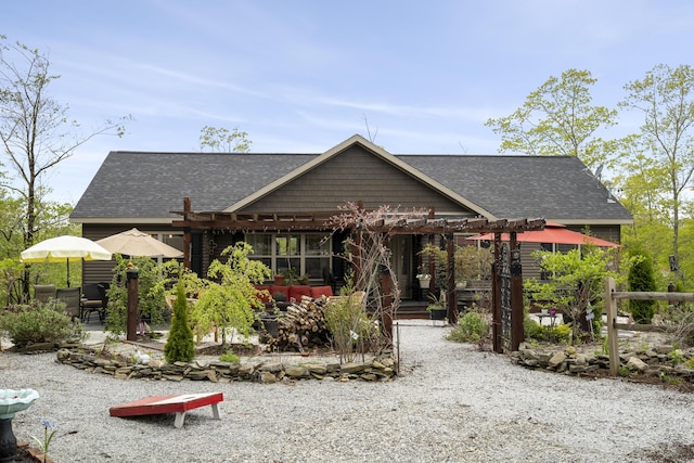 70 Lions Ridge Dr, Alna, ME 04535 - view of front facade featuring a pergola, roof with shingles, and a patio area