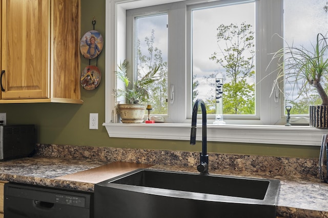 70 Lions Ridge Dr, Alna, ME 04535 - kitchen view of dishwasher, a sink, and dark countertops