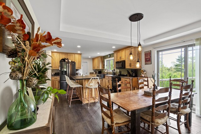 70 Lions Ridge Dr, Alna, ME 04535 - dining space with dark wood-type flooring, a raised ceiling, and recessed lighting