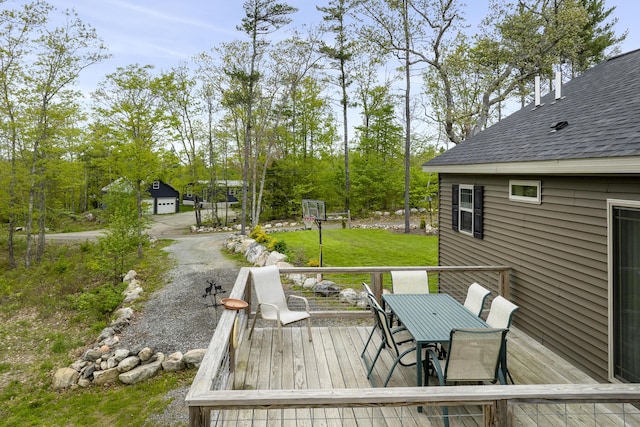 70 Lions Ridge Dr, Alna, ME 04535 - deck with outdoor dining space and view of scattered trees
