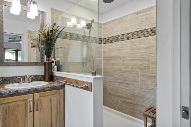 70 Lions Ridge Dr, Alna, ME 04535 - bathroom featuring tiled shower, vanity, and ceiling fan