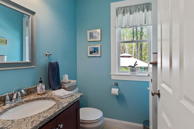 989 Littlefield Rd, Wells, ME 04090 - half bathroom with baseboards, toilet, and vanity