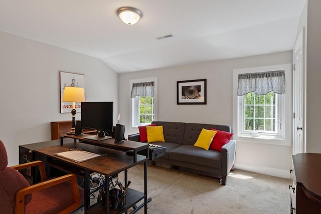 989 Littlefield Rd, Wells, ME 04090 - living area with light carpet, a desk, vaulted ceiling, and baseboards