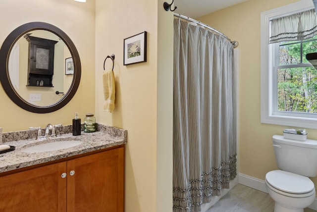 989 Littlefield Rd, Wells, ME 04090 - full bath with toilet, vanity, baseboards, tile patterned flooring, and a shower with curtain