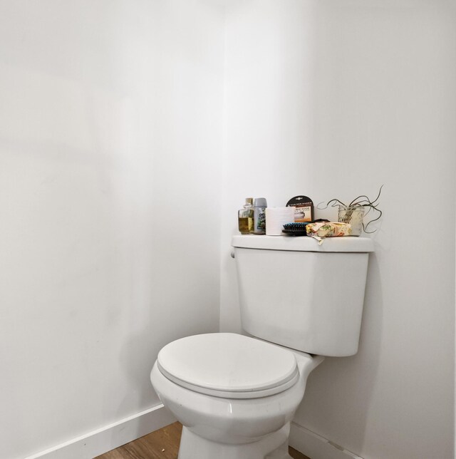 585 Charleston Rd, Charleston, ME 04422 - bathroom with baseboards and wood finished floors