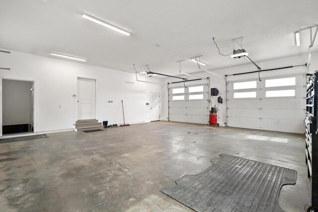 585 Charleston Rd, Charleston, ME 04422 - garage featuring a garage door opener