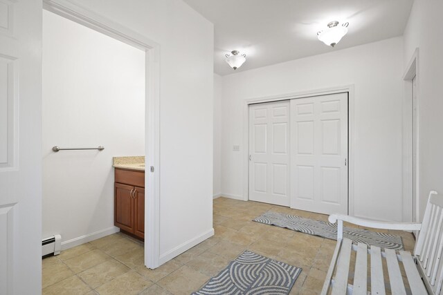 585 Charleston Rd, Charleston, ME 04422 - bathroom with a baseboard heating unit and vanity