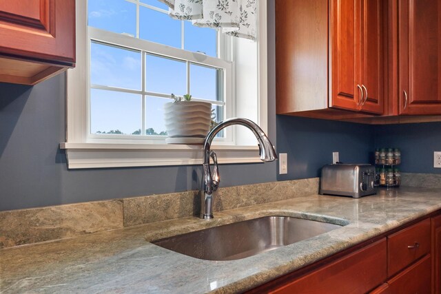 585 Charleston Rd, Charleston, ME 04422 - kitchen with light stone counters and dark brown cabinets