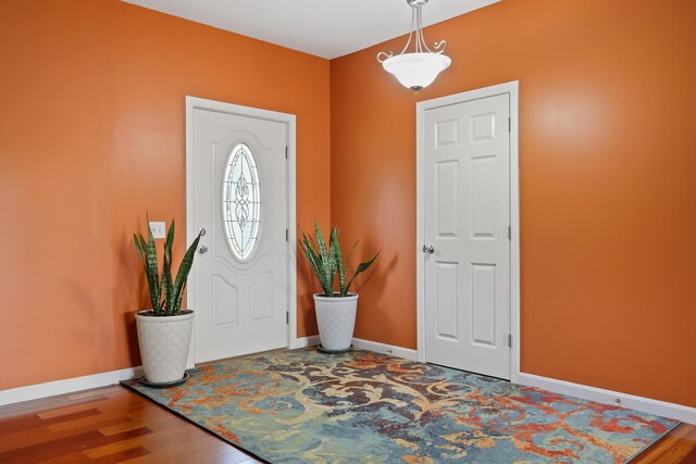 585 Charleston Rd, Charleston, ME 04422 - foyer entrance with wood finished floors and baseboards