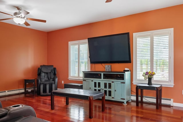 585 Charleston Rd, Charleston, ME 04422 - living room featuring a ceiling fan, a baseboard heating unit, and wood finished floors