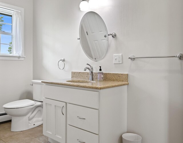 585 Charleston Rd, Charleston, ME 04422 - bathroom with vanity, tile patterned floors, and baseboard heating