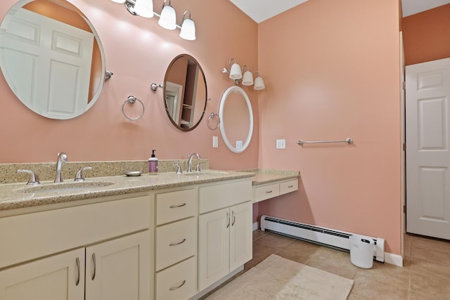 585 Charleston Rd, Charleston, ME 04422 - bathroom with double vanity, tile patterned flooring, and a baseboard radiator