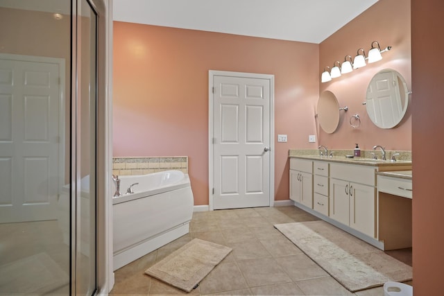 585 Charleston Rd, Charleston, ME 04422 - bathroom with double vanity, tile patterned floors, a shower stall, and a garden tub