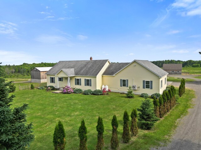 585 Charleston Rd, Charleston, ME 04422 - ranch-style house with a front lawn and a chimney