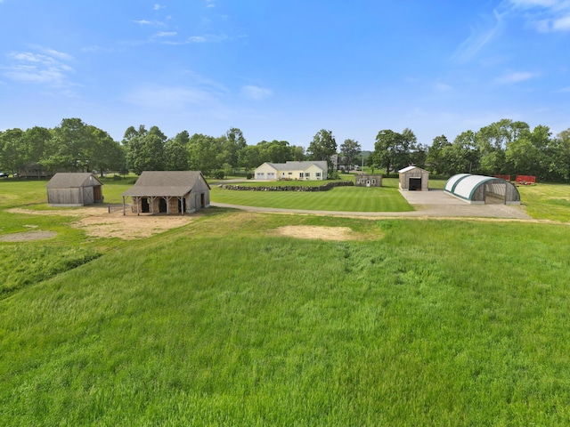 585 Charleston Rd, Charleston, ME 04422 - view of grassy yard with a shed