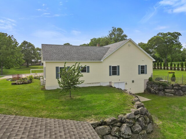 585 Charleston Rd, Charleston, ME 04422 - view of property exterior featuring roof with shingles and a garage
