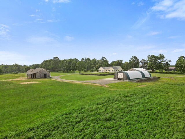 585 Charleston Rd, Charleston, ME 04422 - view of grassy yard featuring an outbuilding