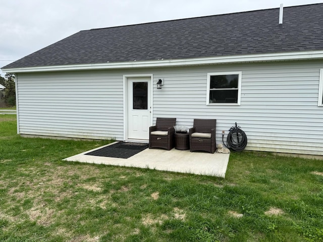 26 Stearns Farm Rd, Hampden, ME 04444 - rear view of house featuring roof with shingles, a yard, and a patio