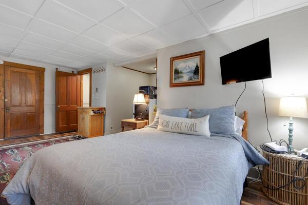 bedroom with wood finished floors