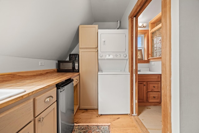 832 Main Rd, Islesboro, ME 04848 - clothes washing area featuring estacked washer and dryer and light wood finished floors